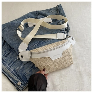 Macro detail of hand-woven straw texture and white leather patchwork on summer fanny pack