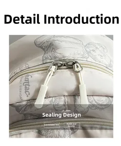 Detail of canvas backpack dual zipper closure with soft white rubber pullers for easy grip