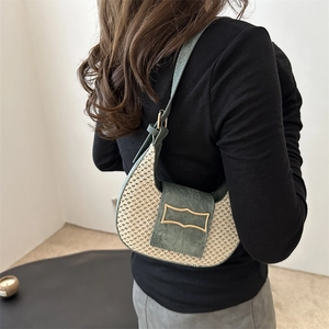 Chic woven crescent shoulder bag with beige texture and dark green suede detailing