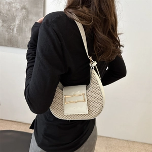Minimalist black and white plaid crescent hobo bag with gold buckle on model