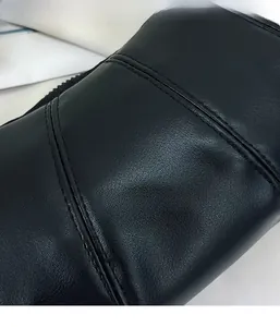 Macro shot of high-quality black leather texture with durable double stitching detail