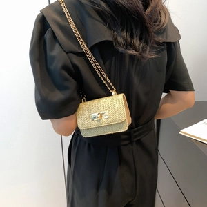 Chic woven straw crossbody bag with gold metal twist lock and chain strap for women