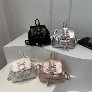 Mini sacs à dos chic en cuir synthétique métallisé avec nœuds en quatre couleurs tendance