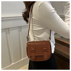 Retro caramel brown PU leather saddle bag with magnetic buckle and adjustable strap
