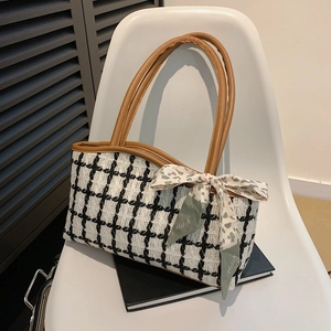 Classic black and white houndstooth tote bag with brown leather handles and silk scarf