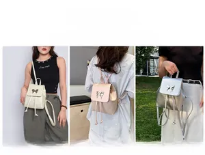 Detail showing three-way carry styles of a minimalist backpack with metal butterfly clasp