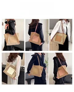 Detailed texture of a large capacity woven straw tote bag with elegant leather shoulder straps