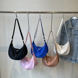 Collection of nylon crescent bags in five colors with metal triangle plate decoration