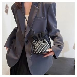 Chic black drawstring bucket bag featuring silver rhinestones on suede fabric