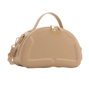 Chic beige quilted shoulder bag with top handle and golden zippers seen from 45-degree angle