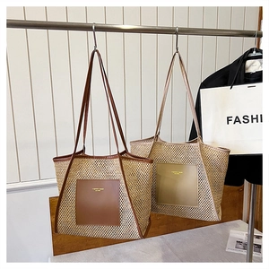 Detail of woven straw tote bags with leather trim and gold embossed pockets for summer