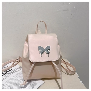 Detail view of pink backpack with silver butterfly hardware and drawstring closure