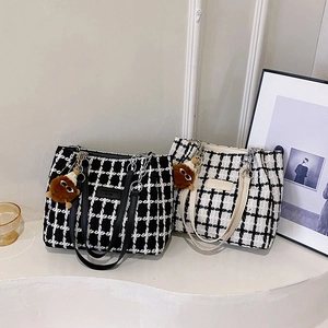 Large plaid tweed tote bags in black and white with leather handles and bear charms