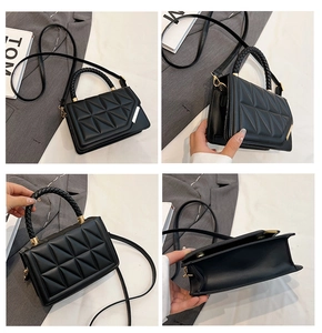 Detail view of black quilted crossbody bag with geometric texture and gold metal accents