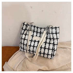 Black and white checkered tweed tote bag with faux leather straps and chain details
