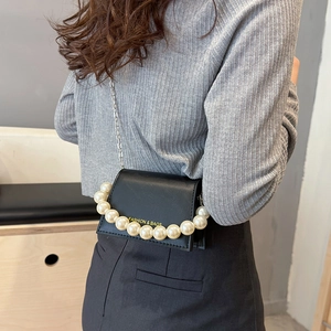 Minimalist black PU leather crossbody bag with faux pearl handle and metal chain strap