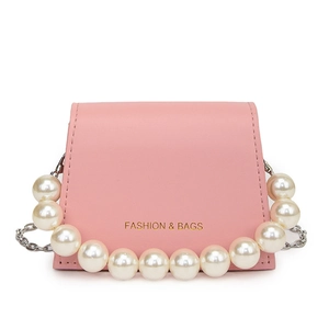 Pink PU leather mini crossbody bag with large pearl handle and silver chain on white background