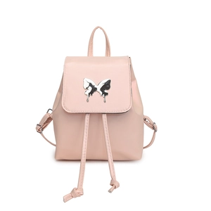 Minimalist pink faux leather backpack for women with a unique silver fluid butterfly ornament