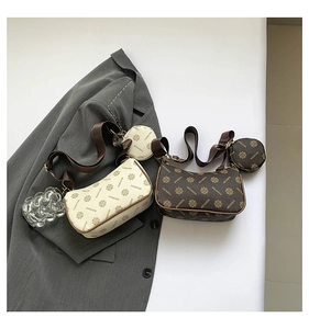 Detail view of two vintage print crossbody bags with detachable round coin purses