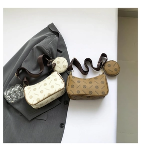Detail of vintage patterned crossbody bags with matching round coin purses and wide straps