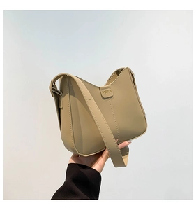 Detail of khaki crescent shoulder bag with FASHION logo and smooth synthetic leather