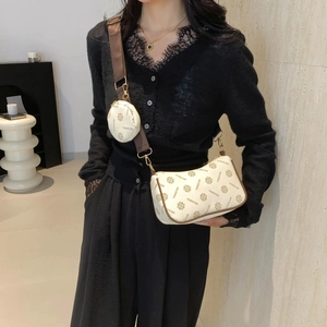 Two-piece set monogram crossbody bag with wide strap and round coin purse in cream