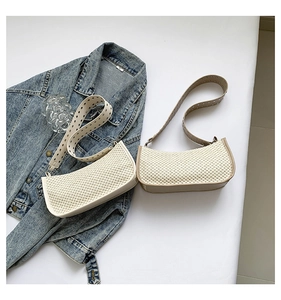 Close-up of woven texture straw and PU bags with metallic grommet wide straps in two colors