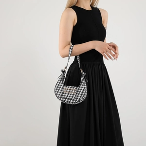 Classic black and white houndstooth hobo bag with metal buckle for casual summer wear