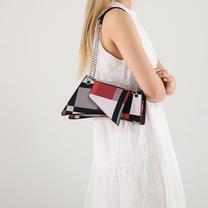 Stylish color-block crossbody bag with red and black geometric pattern and silver chain