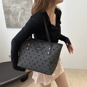 Fashionable dark grey star print tote bag with black shoulder straps and chic bow patterns