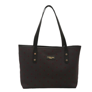 Fashionable women's tote bag with red star print and premium black leather handles
