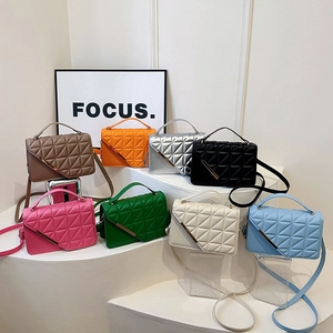 Quilted crossbody bag collection in eight vibrant colors with gold metal flap detail