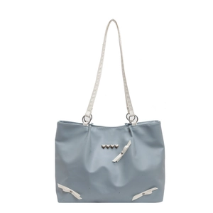 Light blue shoulder bag with white bow and heart studs for summer casual style