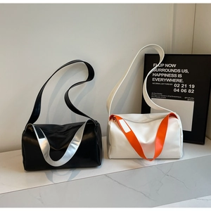 Detail of trendy Boston bags in black-silver and white-orange with wide straps