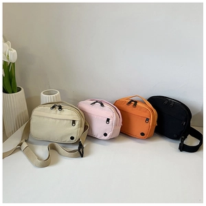 Nylon crossbody bags in beige, pink, orange, and black colors displayed with flowers
