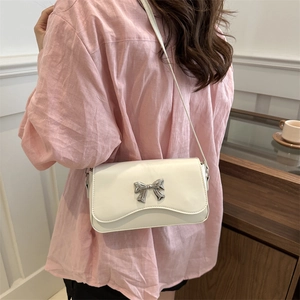 Elegant white square shoulder bag with silver metal bow and chain strap for women