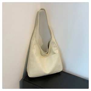 Detail view of the geometric paneled texture on this off-white hobo shoulder bag