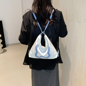 Blue and white butterfly style shoulder bag with spacious design for daily commuting