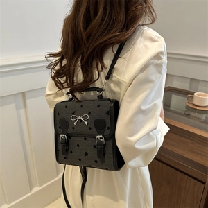 Vintage dunkelgrauer Rucksack mit Polka Dots, silberner Schleife und Trageriemen