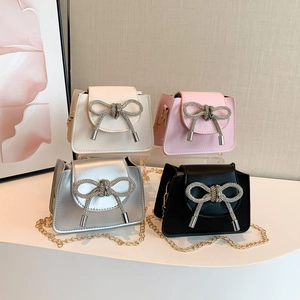 Elegant mini crossbody chain bags with luxury rhinestone bows in black, white, pink and silver