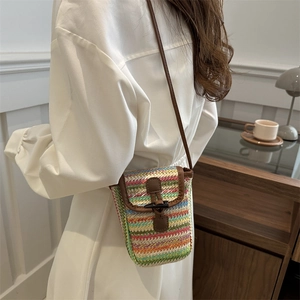 Rainbow striped straw woven crossbody phone bag with leather trim and horn buckle closure