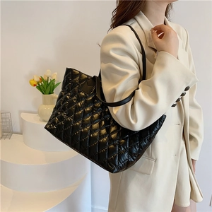 Minimalist black quilted tote bag with diamond pattern and large capacity for women