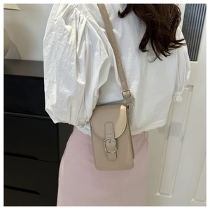Detailed side view of the beige crossbody phone bag with adjustable strap and metal buckle