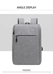 Vista frontale zaino grigio minimalista per laptop aziendale con porta di ricarica USB