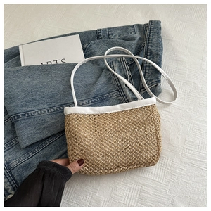 Detailed straw woven handbag with white leather trim and soft inner lining