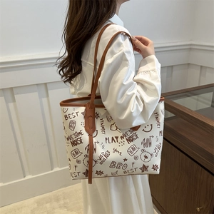 Retro graffiti tote bag with large capacity and brown leather trim for casual style