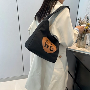 Minimalist black canvas hobo bag with large capacity and round WG letter leather patch