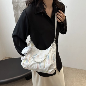 White tote bag with rainbow embroidery, plush cloud charm and silver chain strap