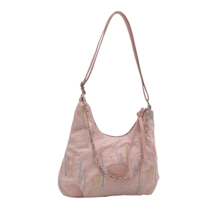 Pink faux leather tote bag featuring colorful embroidery and classic monogram embossed texture