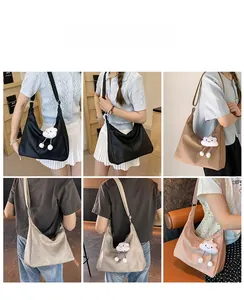 Tote bags in four colors with plush cloud charms and tassel details shown on a model